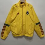 REAL MADRID CORTAVIENTO AMARILLO 2024/25